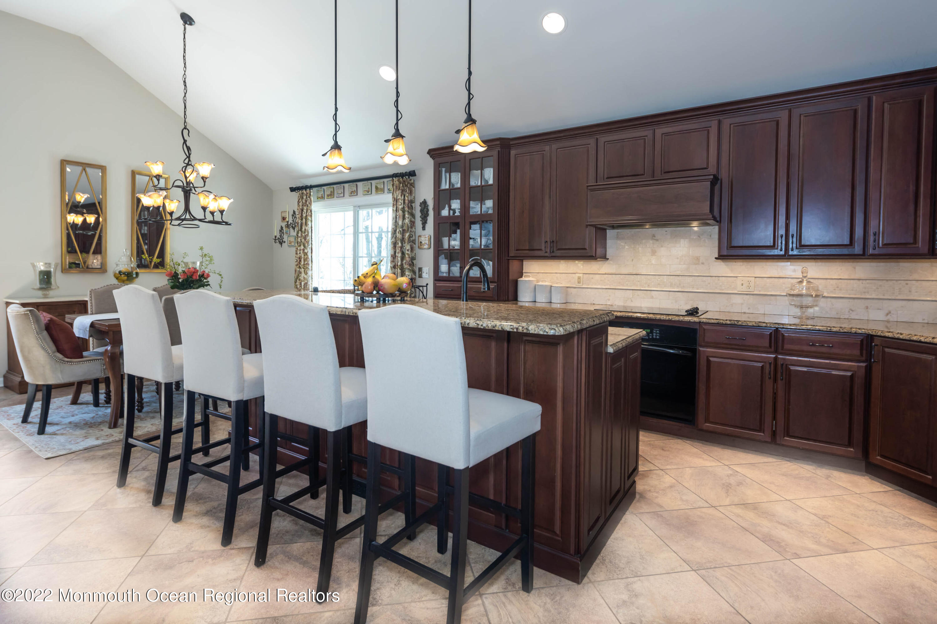 361 Dwight Road Middletown, NJ 07748 - Photo 11 of 39 a kitchen with cabinets dining table and chairs