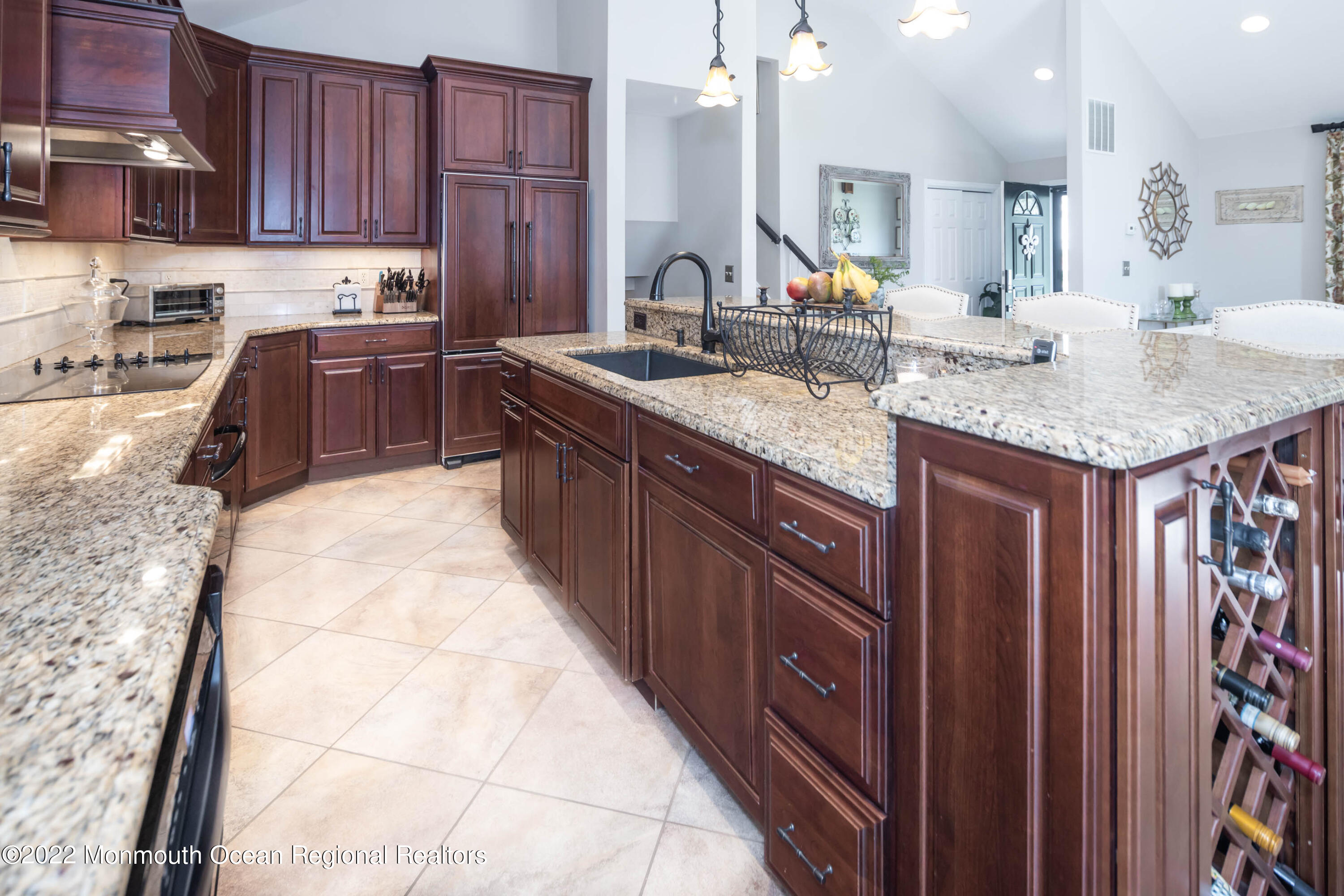 361 Dwight Road Middletown, NJ 07748 - Photo 12 of 39 a kitchen with kitchen island granite countertop a sink dishwasher stove and cabinets