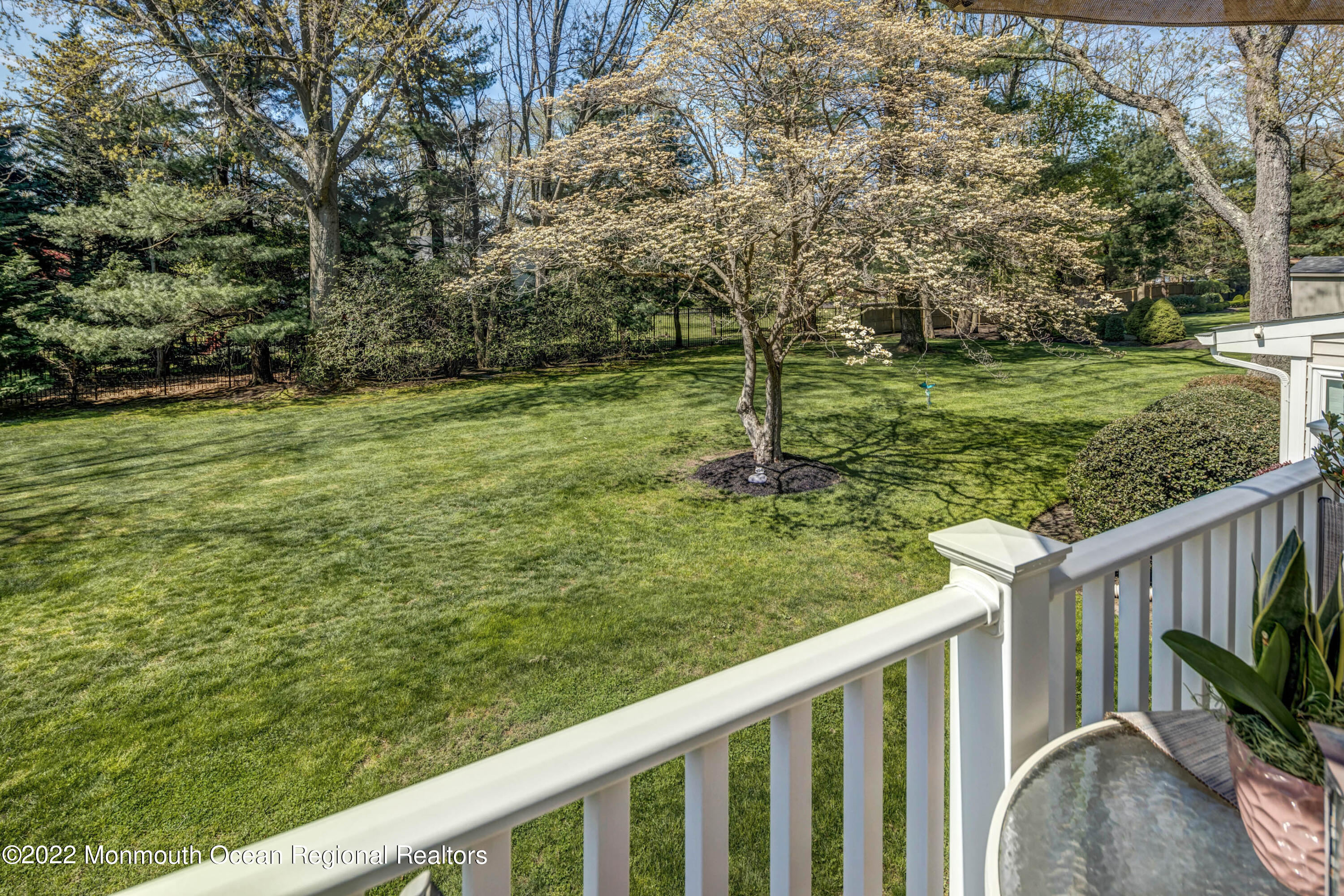 361 Dwight Road Middletown, NJ 07748 - Photo 19 of 39 a balcony with trees in front of it