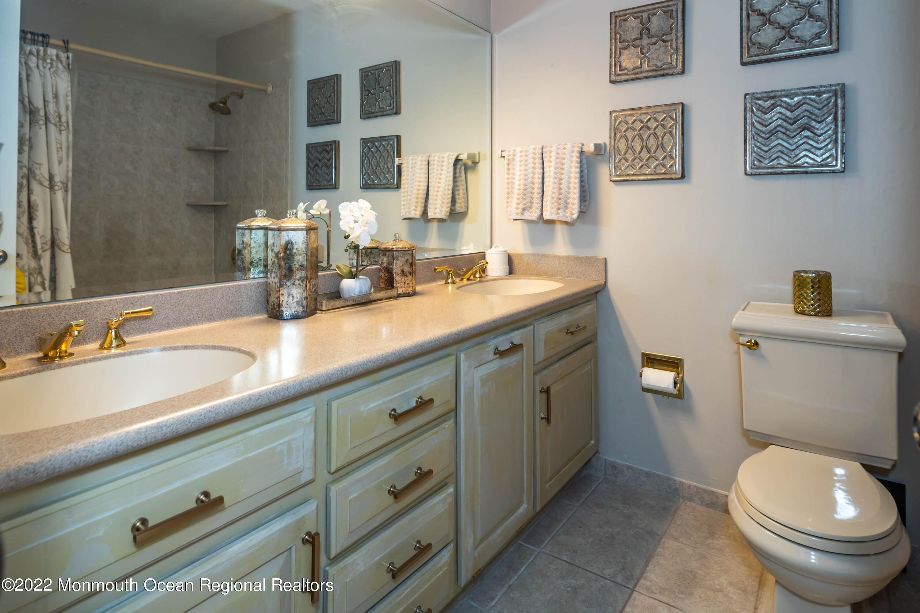 361 Dwight Road Middletown, NJ 07748 - Photo 25 of 39 a bathroom with a granite countertop toilet sink and mirror