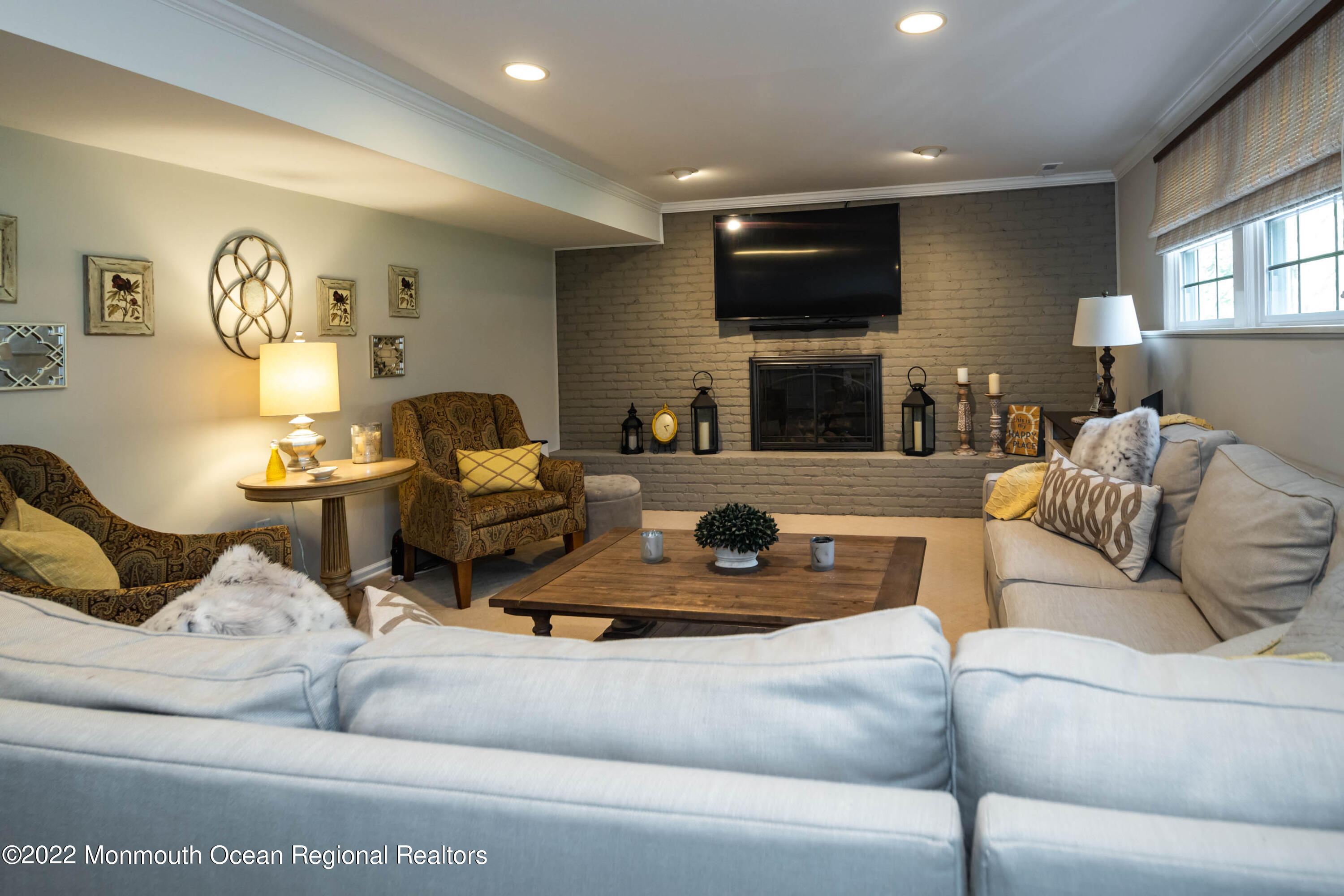 361 Dwight Road Middletown, NJ 07748 - Photo 27 of 39 a living room with furniture and a flat screen tv