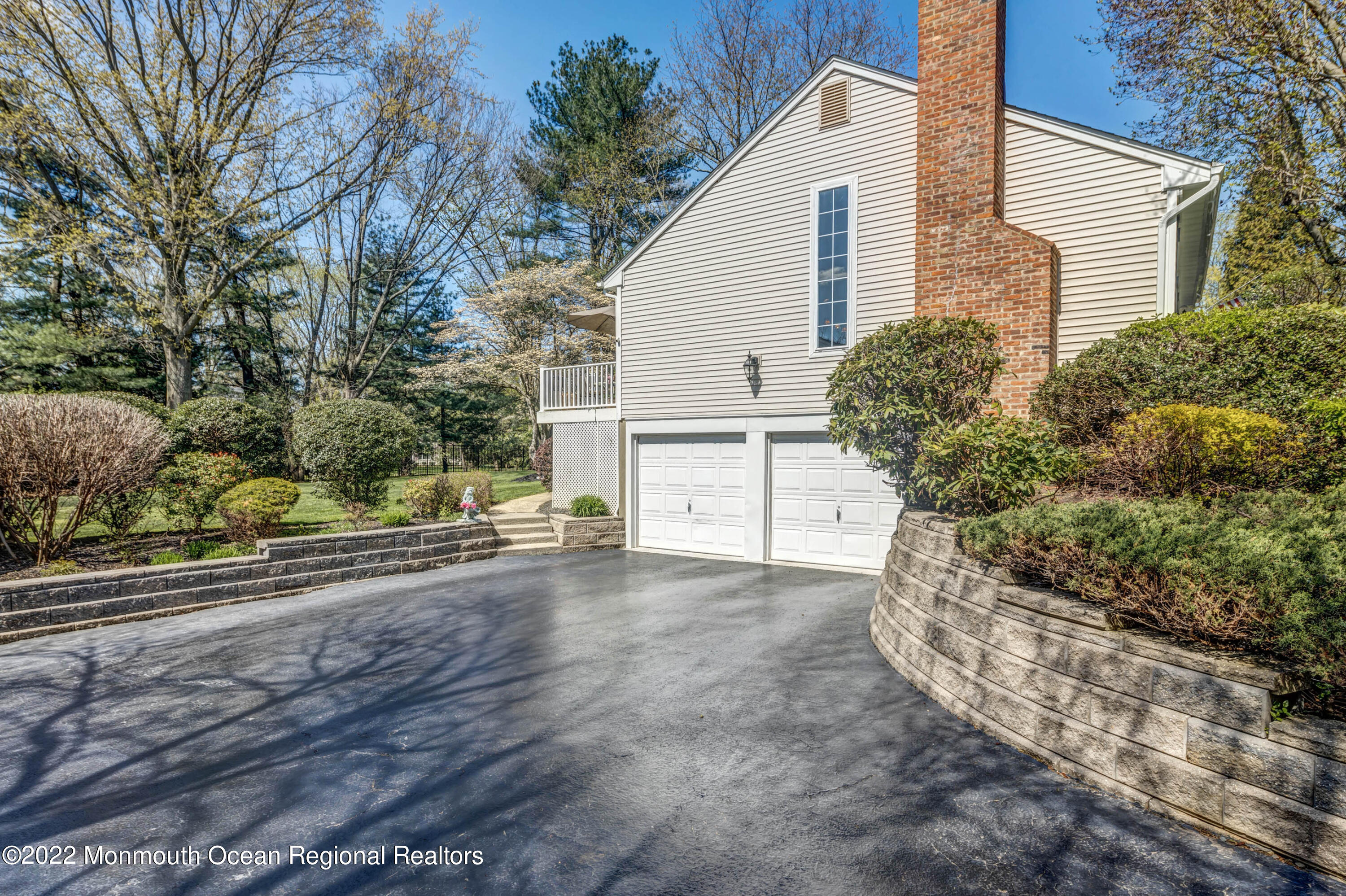 361 Dwight Road Middletown, NJ 07748 - Photo 34 of 39 a view of a house with a yard and garage