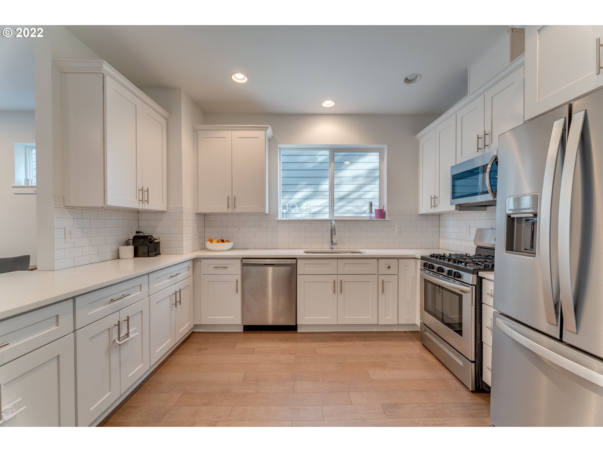 4209 Southeast 80th Avenue Portland, OR 97206 - Photo 13 of 32 a kitchen with a sink stove and refrigerator