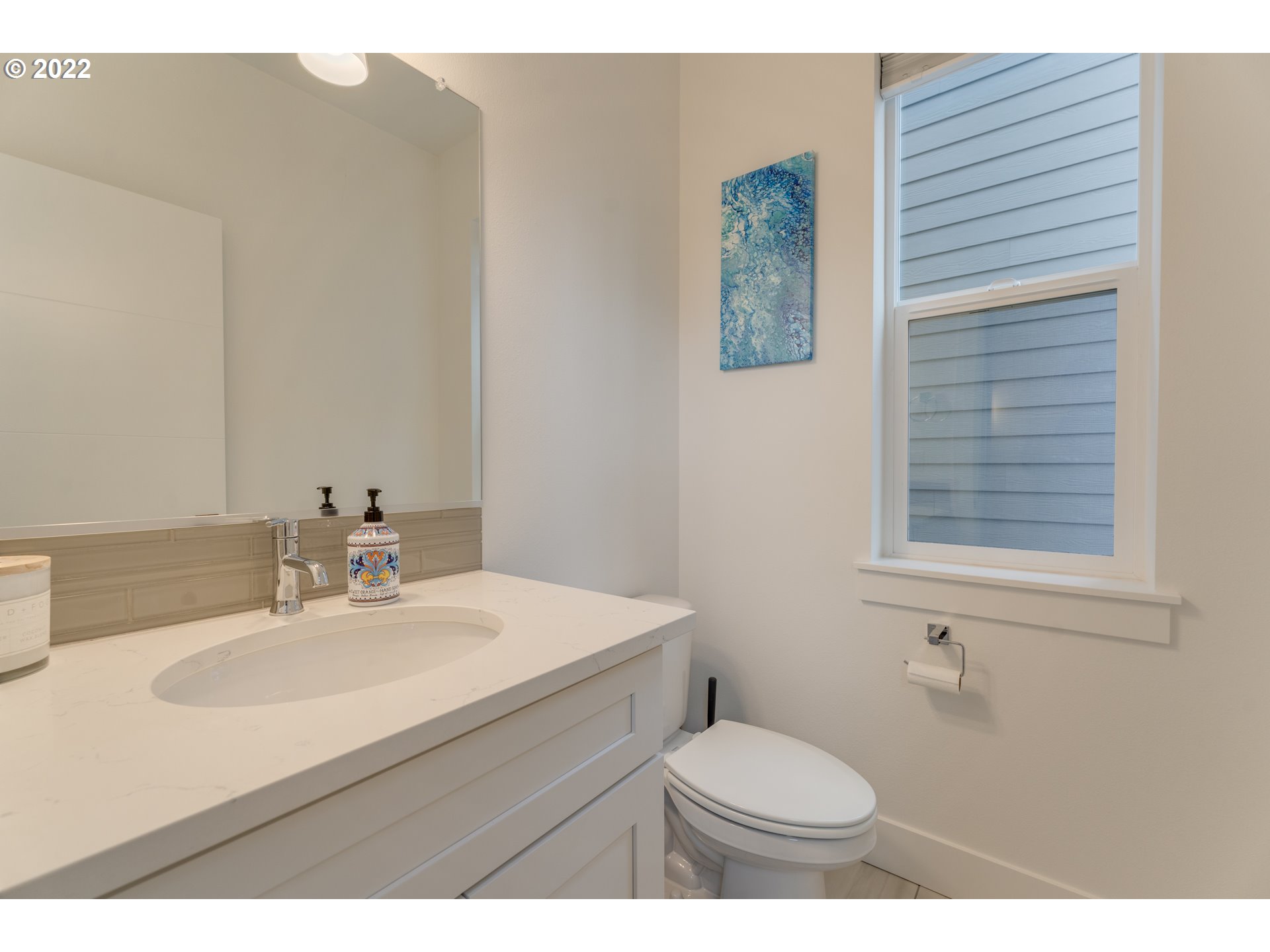 4209 Southeast 80th Avenue Portland, OR 97206 - Photo 16 of 32 a bathroom with a sink toilet and a mirror