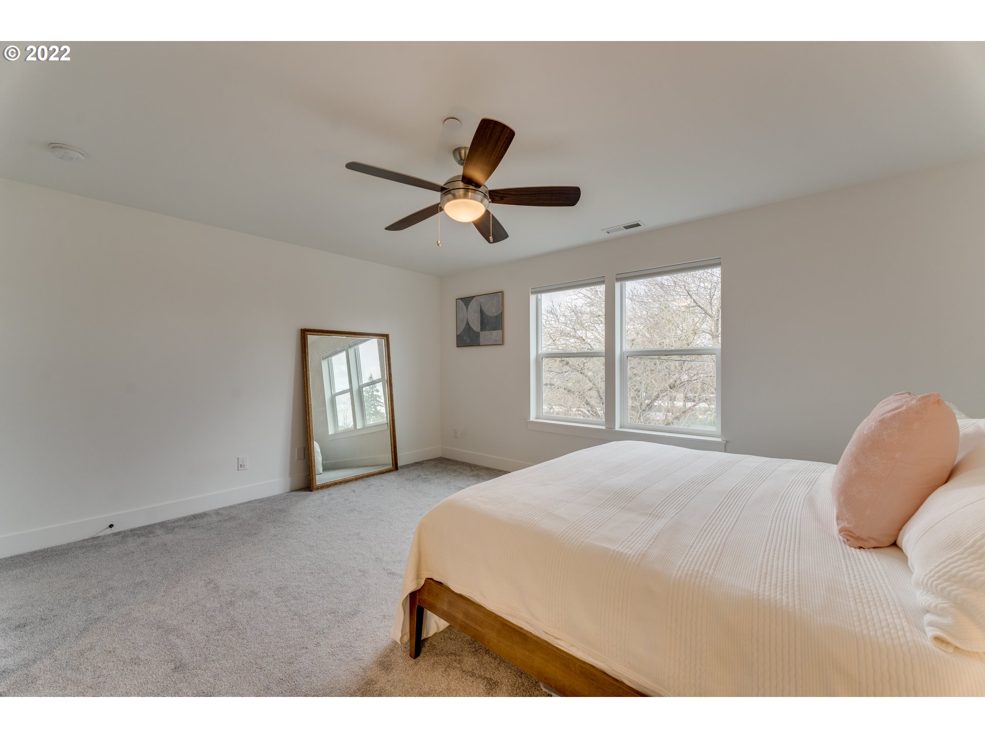 4209 Southeast 80th Avenue Portland, OR 97206 - Photo 20 of 32 a bedroom with a bed and a large window
