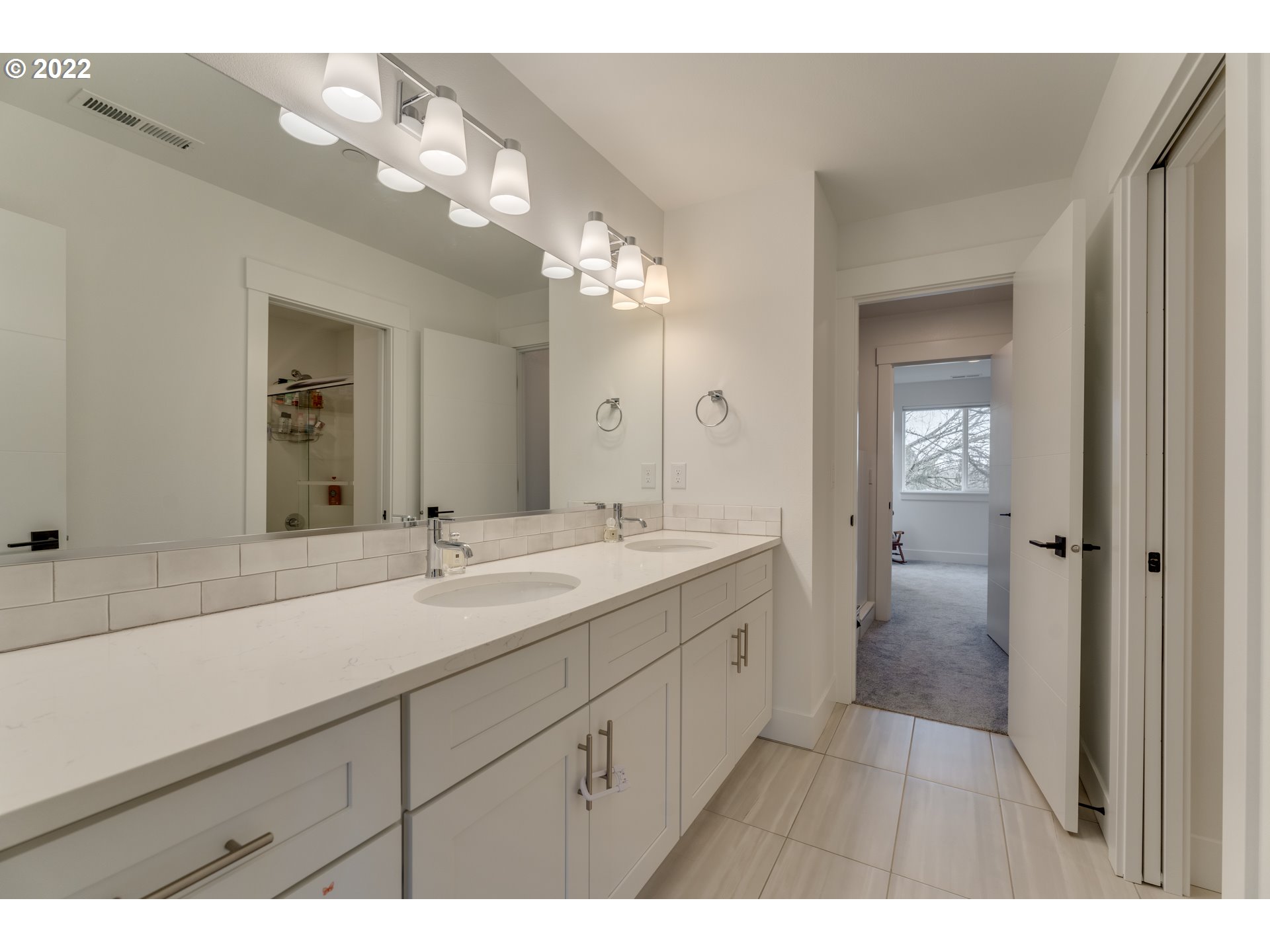 4209 Southeast 80th Avenue Portland, OR 97206 - Photo 21 of 32 a bathroom with a sink and a mirror