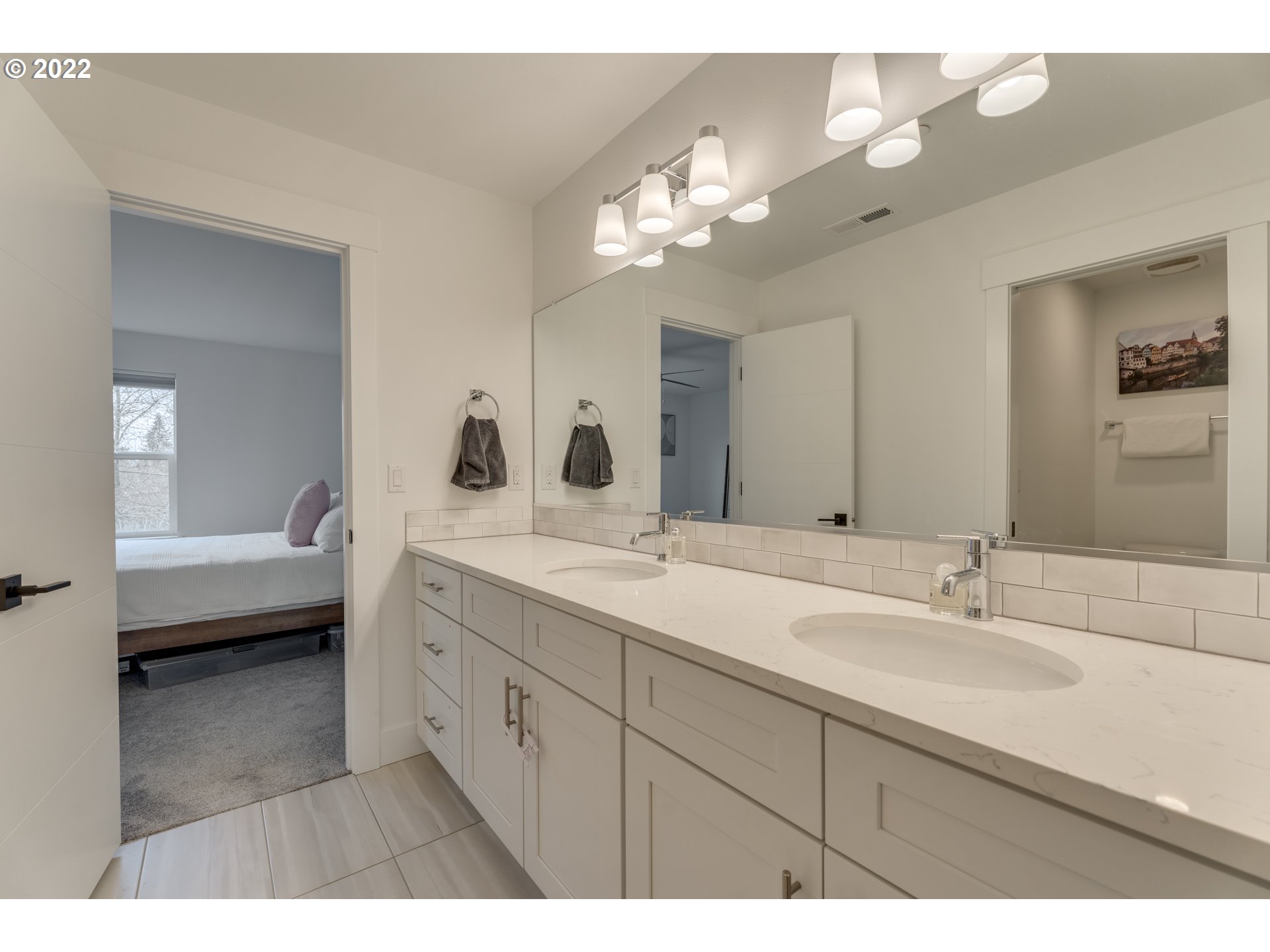 4209 Southeast 80th Avenue Portland, OR 97206 - Photo 22 of 32 a en suite bathroom with a double vanity sink and a mirror