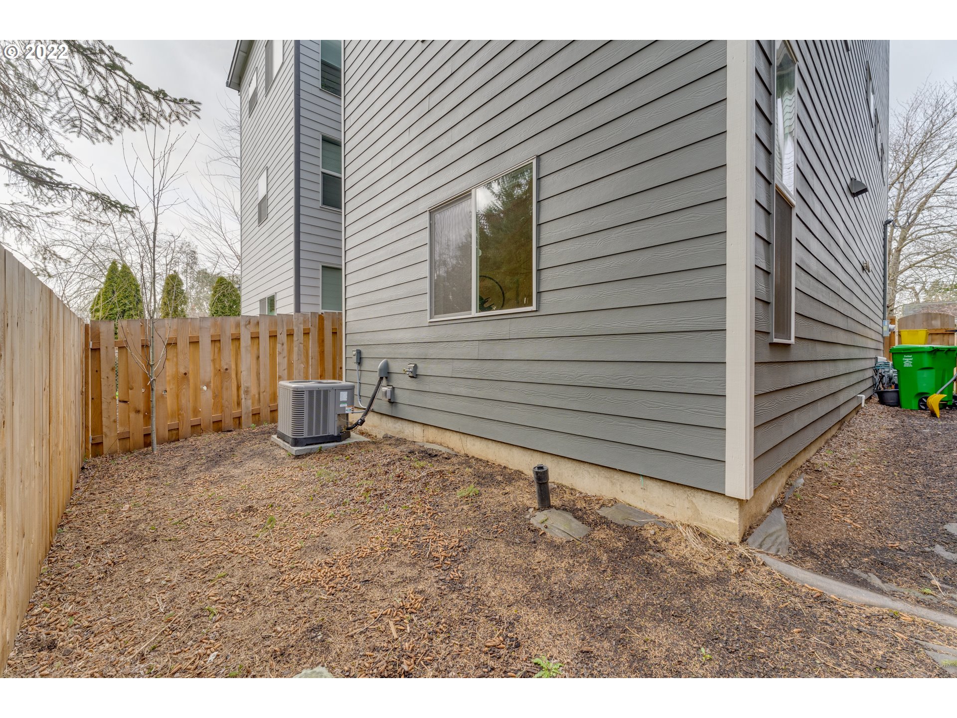 4209 Southeast 80th Avenue Portland, OR 97206 - Photo 27 of 32 a view of backyard of house with wooden fence