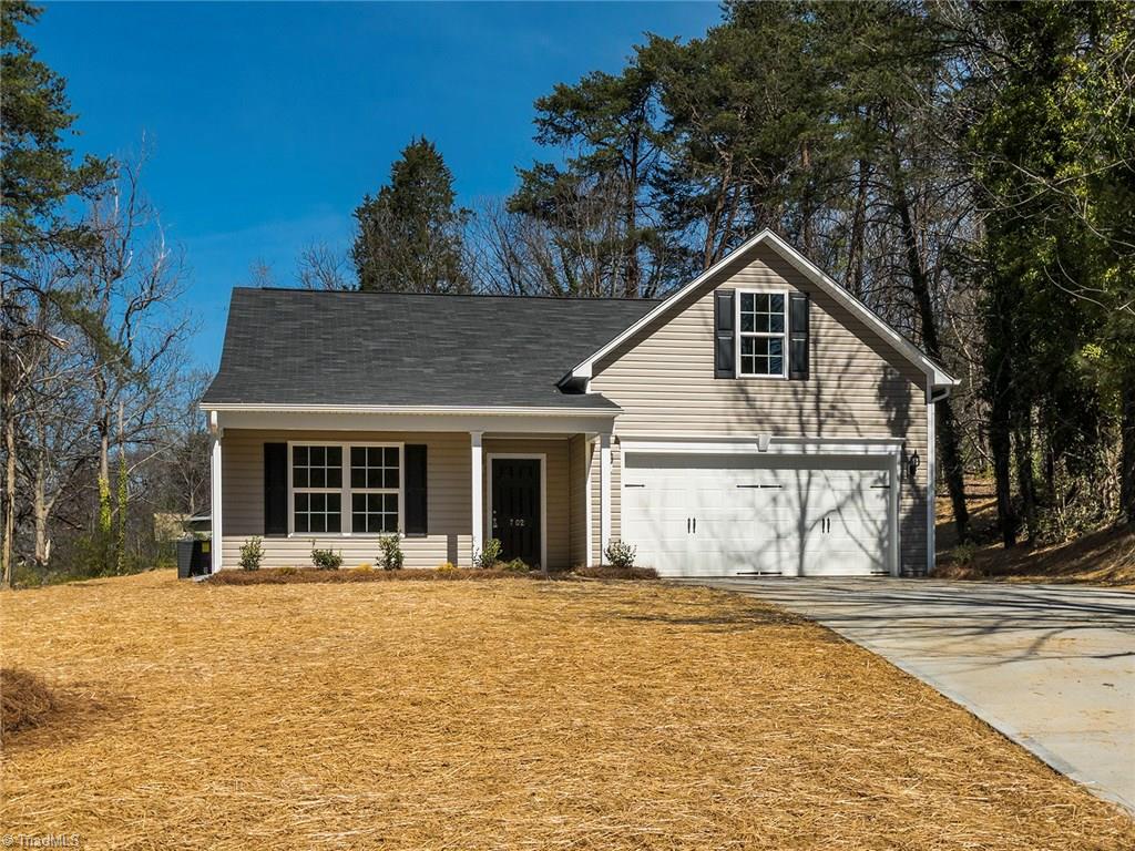 702 Prince Road Greensboro, NC 27455 - Photo 1 of 22 WELCOME HOME to 702 Prince Road! Rocker front porch, freshly strawed yard, and 2 car garage overlooking gracious front yard.
