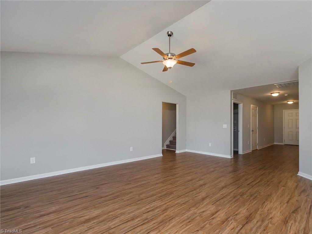 702 Prince Road Greensboro, NC 27455 - Photo 3 of 22 Great room w/ VAULTED CEILINGS and wide plank engineered floors. NEW PAINT and NEW FIXTURES.