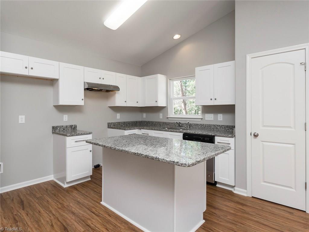 702 Prince Road Greensboro, NC 27455 - Photo 6 of 22 Granite counters, SLOW CLOSE CABINETS AND DRAWERS, and stainless steel appliances. Stainless smooth top range will be installed by the time this listing goes active.