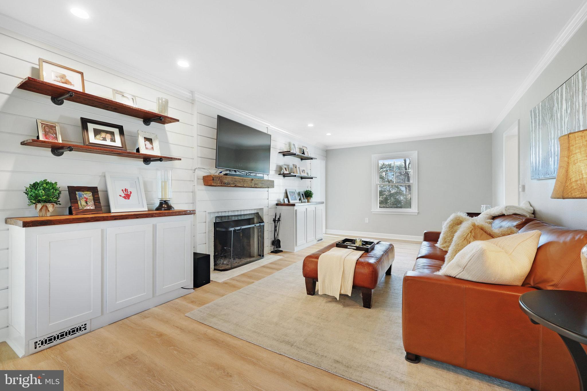 2100 Post Road Vienna, VA 22181 - Photo 11 of 72 Living Room with a wood burning fireplace.
