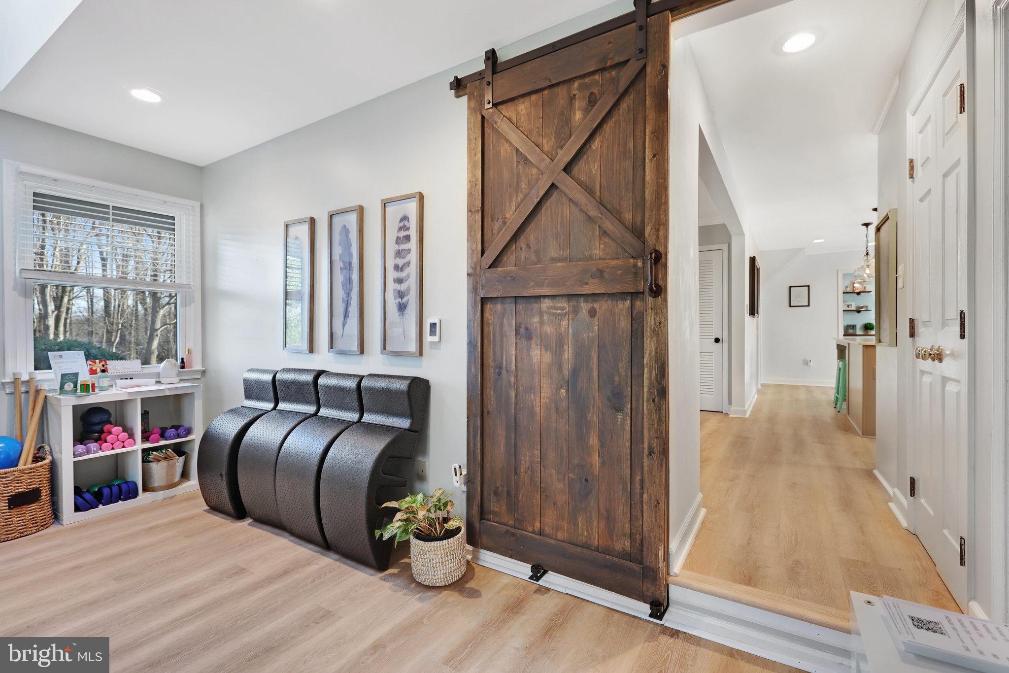 2100 Post Road Vienna, VA 22181 - Photo 36 of 72 Barn door from Rec Room to Kitchen