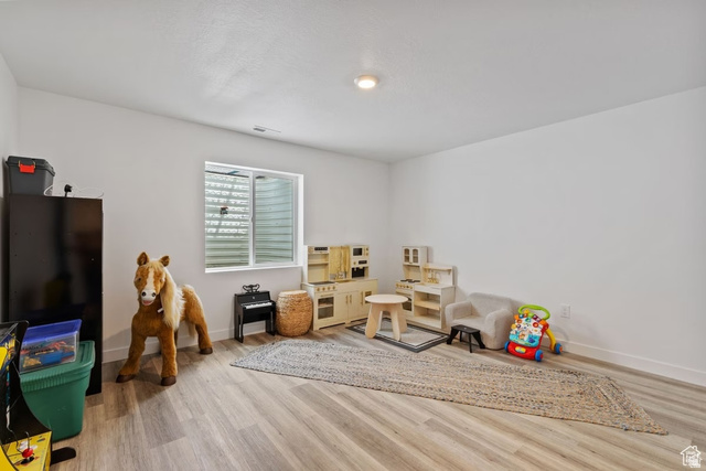 1323 South Raintree Lane Santaquin, UT 84655 - Photo 18 of 23 Game room featuring baseboards and light wood finished floors