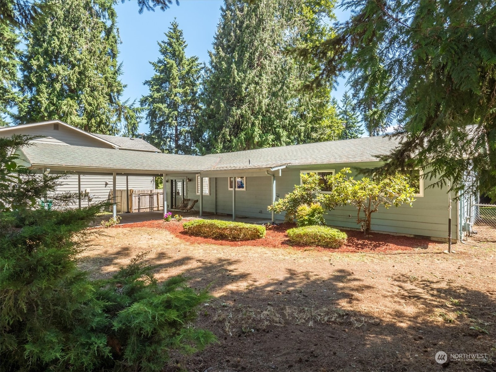 1126 203rd Place Southeast Bothell, WA 98012 - Photo 1 of 26 a view of a house with a yard and garage