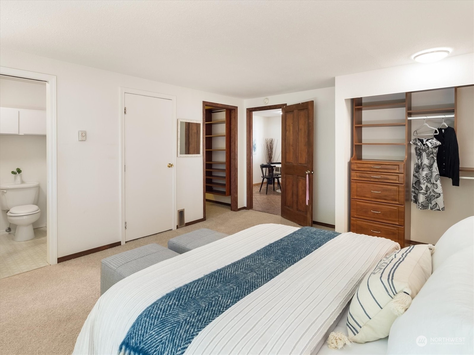 1126 203rd Place Southeast Bothell, WA 98012 - Photo 12 of 26 a bedroom with a bed and a walk in closet