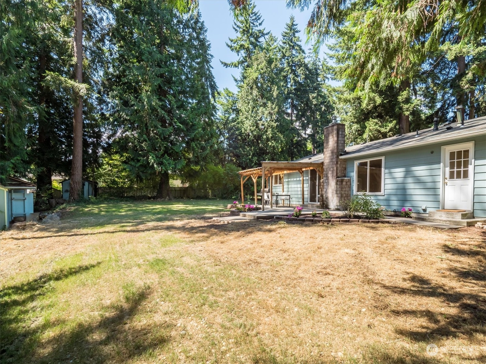 1126 203rd Place Southeast Bothell, WA 98012 - Photo 26 of 26 a view of a house with a yard and sitting area