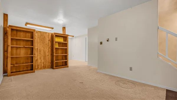 a view of an empty room with a closet