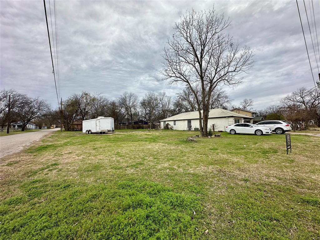 1101 North Border Street Cleburne, TX 76031 - Photo 5 of 7 a front view of a house with garden