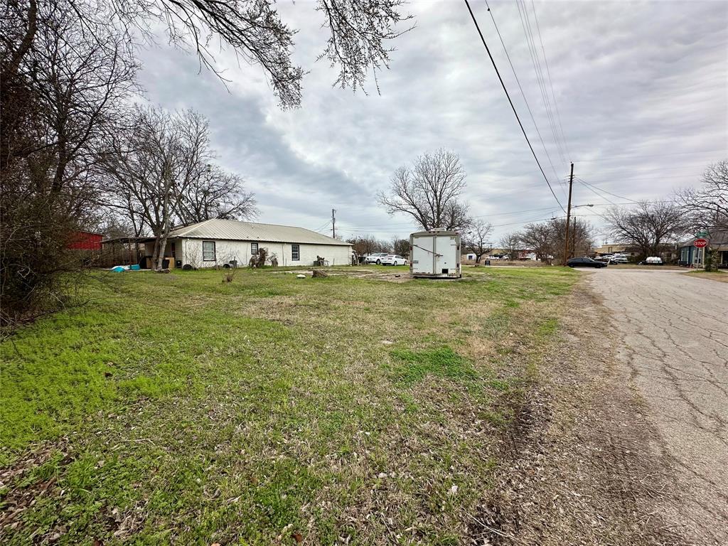 1101 North Border Street Cleburne, TX 76031 - Photo 6 of 7 a view of a yard with large trees