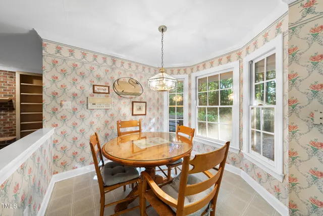 a dining room with furniture and window