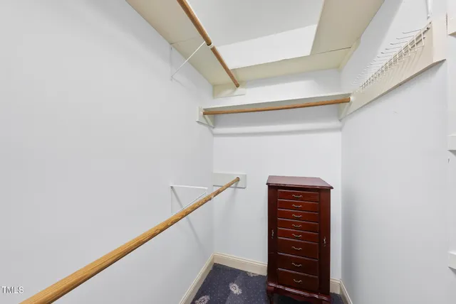 a view of closet with stairs