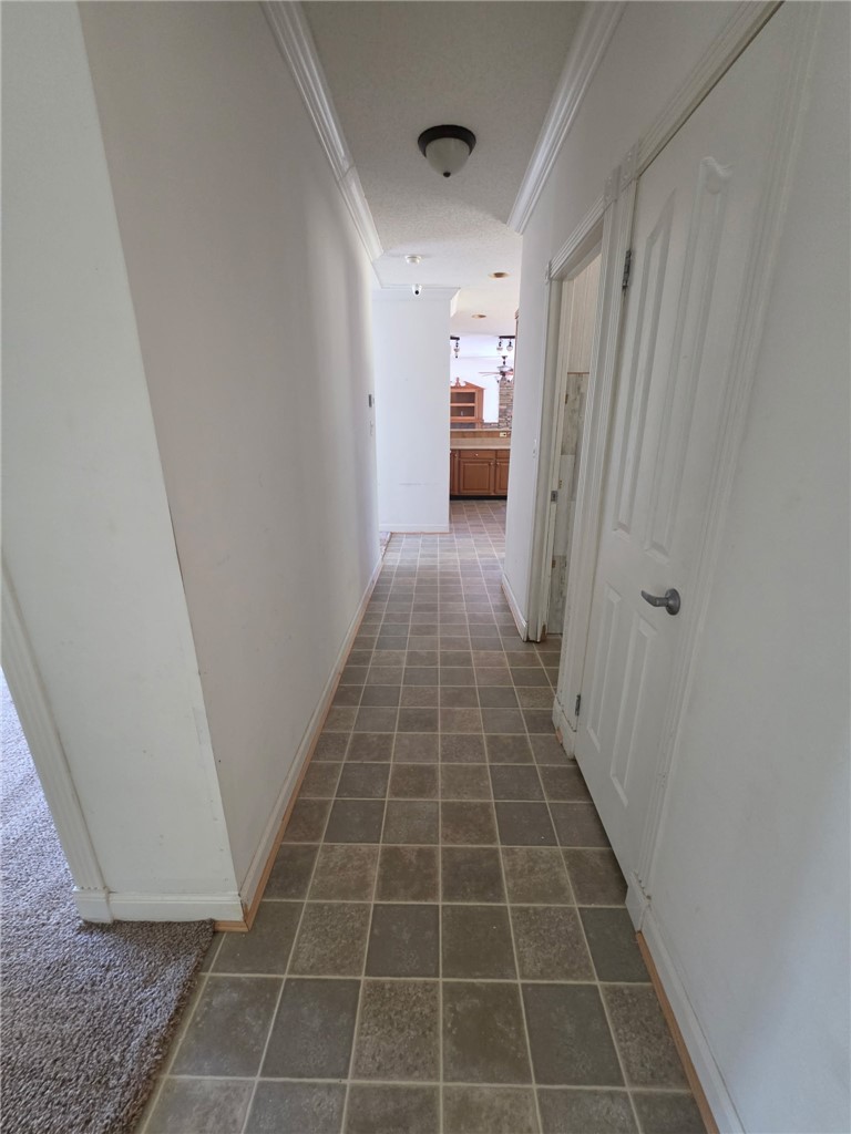 1400 Massey Road Pendleton, SC 29670 - Photo 24 of 25 This interior hallway features classic tile flooring, guiding you through a seamless transition to the adjacent rooms.
