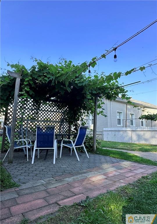 8 Spring Street South River, NJ 08882 - Photo 4 of 8 a view of a backyard with table and chairs with a yard and plants