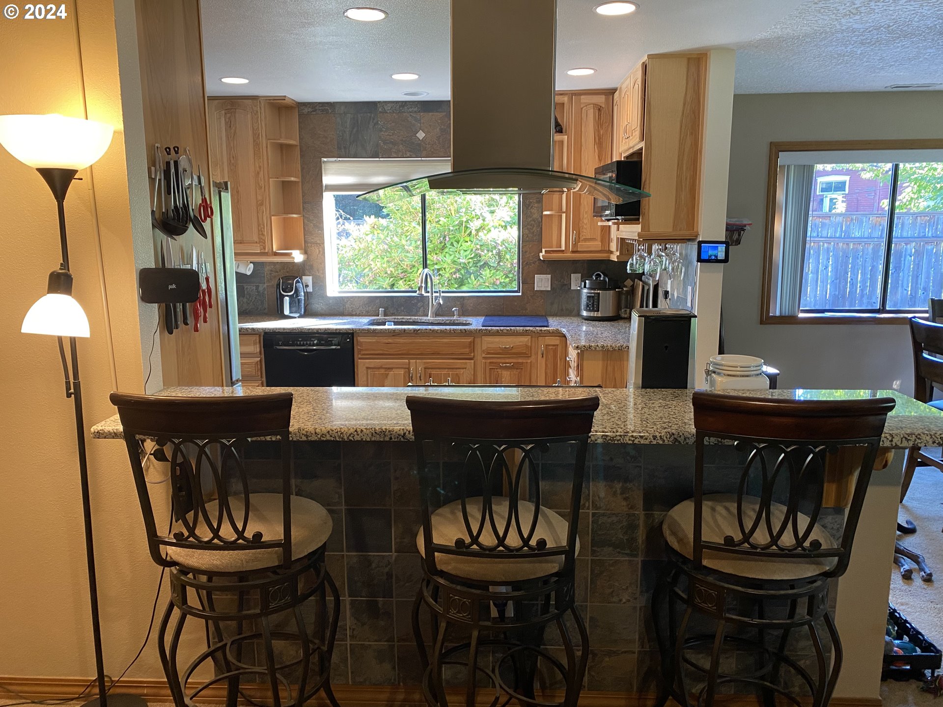 3608 Northwest McCann Road Vancouver, WA 98685 - Photo 17 of 47 a kitchen with a dining table and chairs