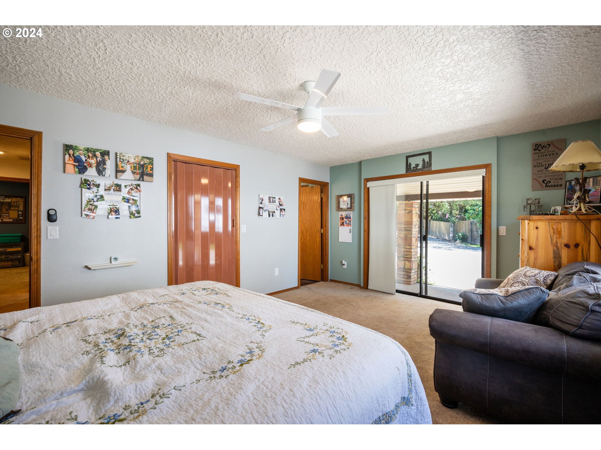 3608 Northwest McCann Road Vancouver, WA 98685 - Photo 26 of 47 a bedroom with a bed painting on wall and a large window