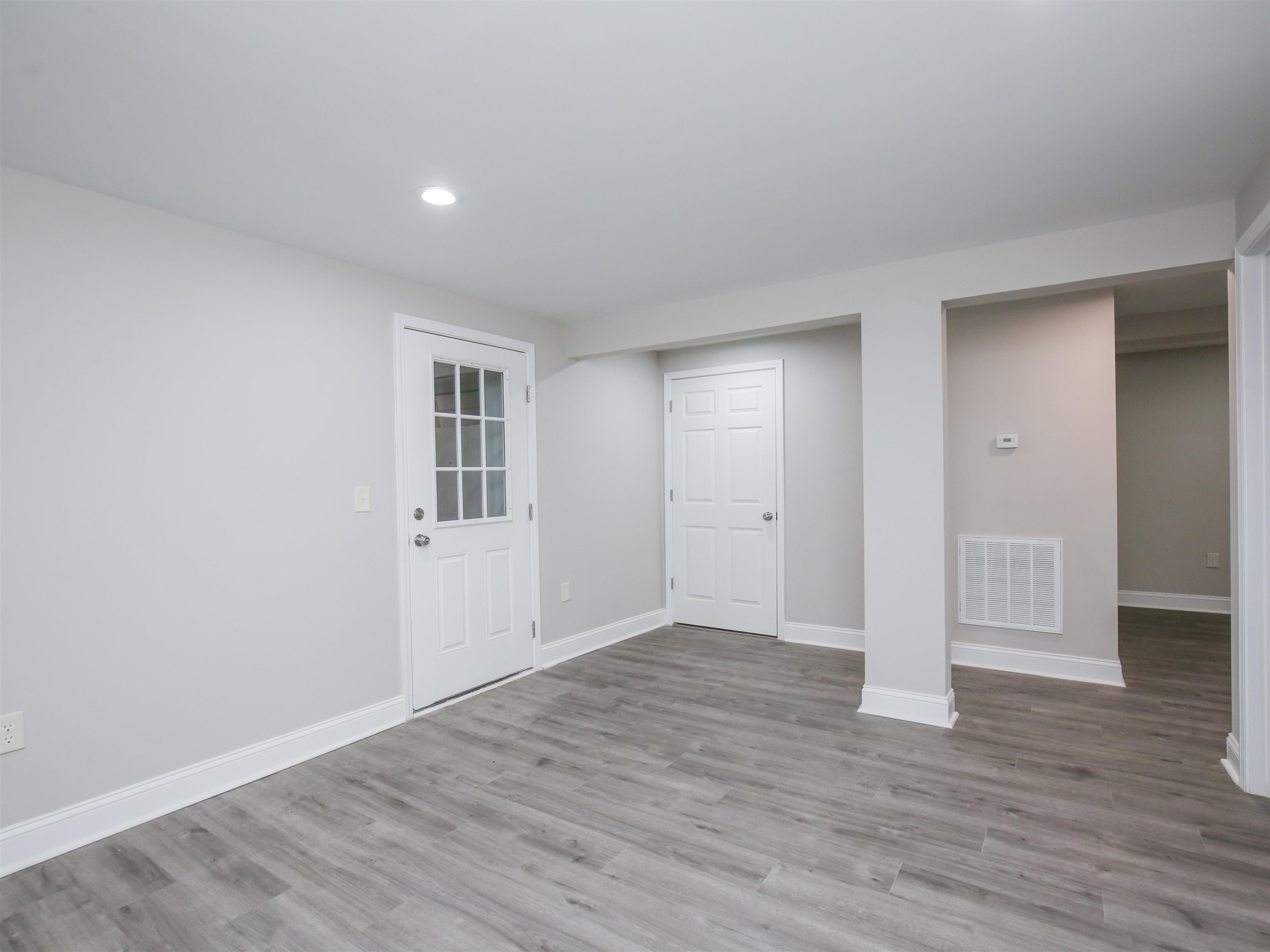 1519 Creech Road Garner, NC 27529 - Photo 38 of 45 a view of an empty room with wooden floor