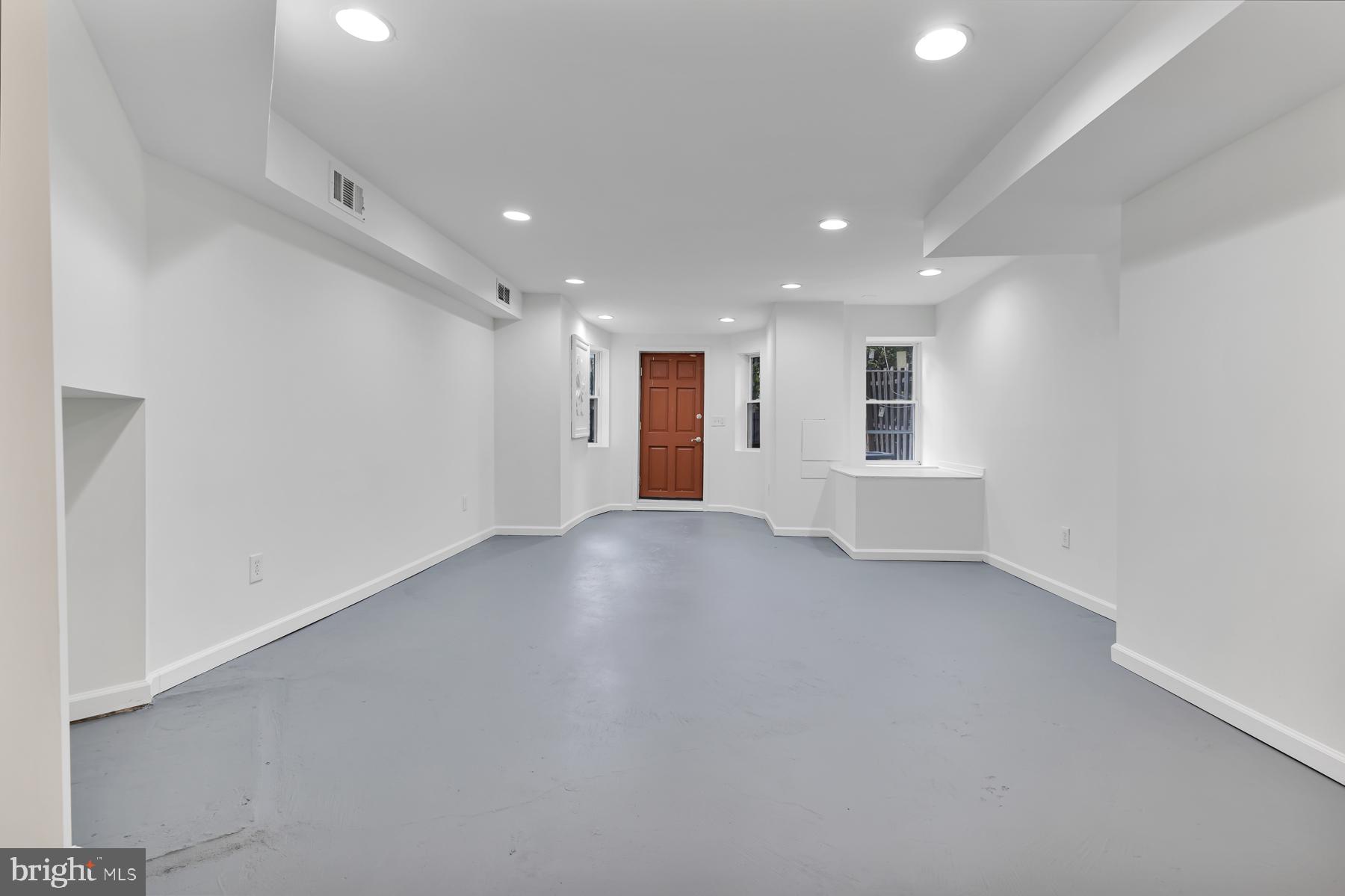 1926 Mt Royal Terrace Baltimore, MD 21217 - Photo 30 of 34 finished basement with walk out entrance