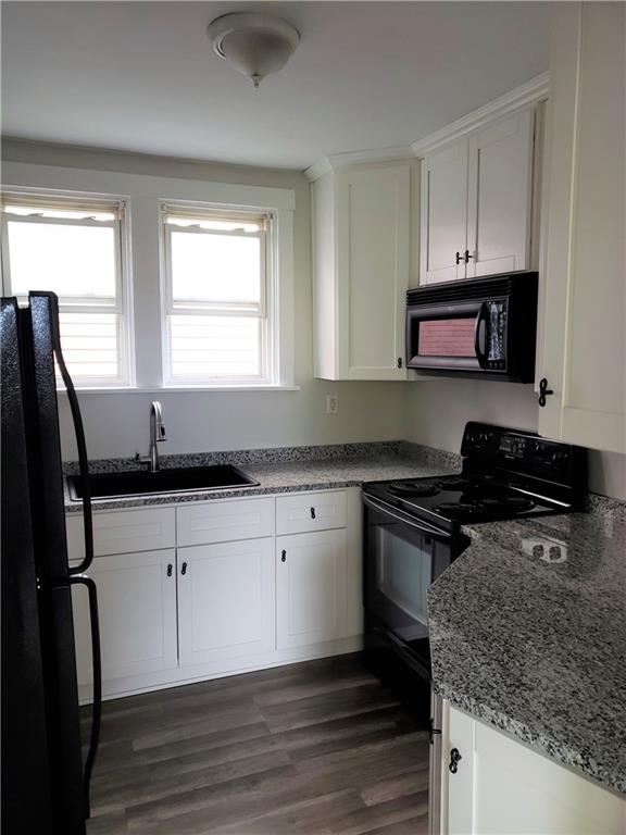 201 Richbarn Road Pittsburgh, PA 15212 - Photo 14 of 24 a kitchen with stainless steel appliances granite countertop a sink stove and microwave