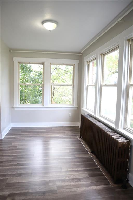 201 Richbarn Road Pittsburgh, PA 15212 - Photo 3 of 24 a view of an empty room with wooden floor and a window