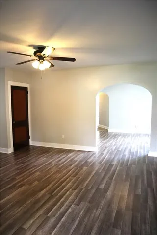 a view of a room with wooden floor