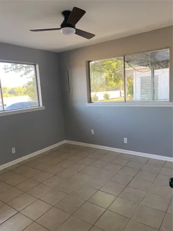 a view of an empty room with a window