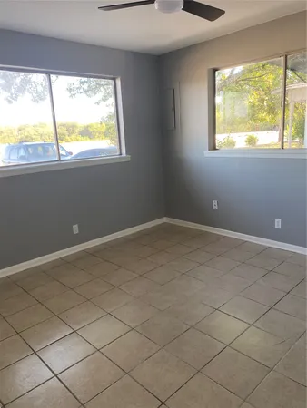 a view of an empty room and window