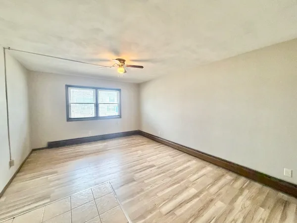 a view of an empty room and window