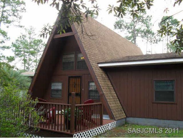 3121 Green Acres Road St. Augustine, FL 32084 - Photo 1 of 35 a view of a house with a deck