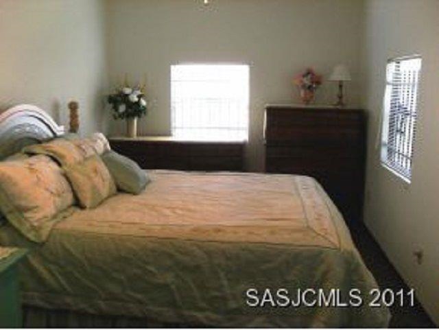 3121 Green Acres Road St. Augustine, FL 32084 - Photo 11 of 35 a bedroom with a bed and window