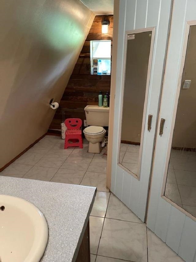 3121 Green Acres Road St. Augustine, FL 32084 - Photo 13 of 35 a bathroom with a granite countertop sink and a mirror