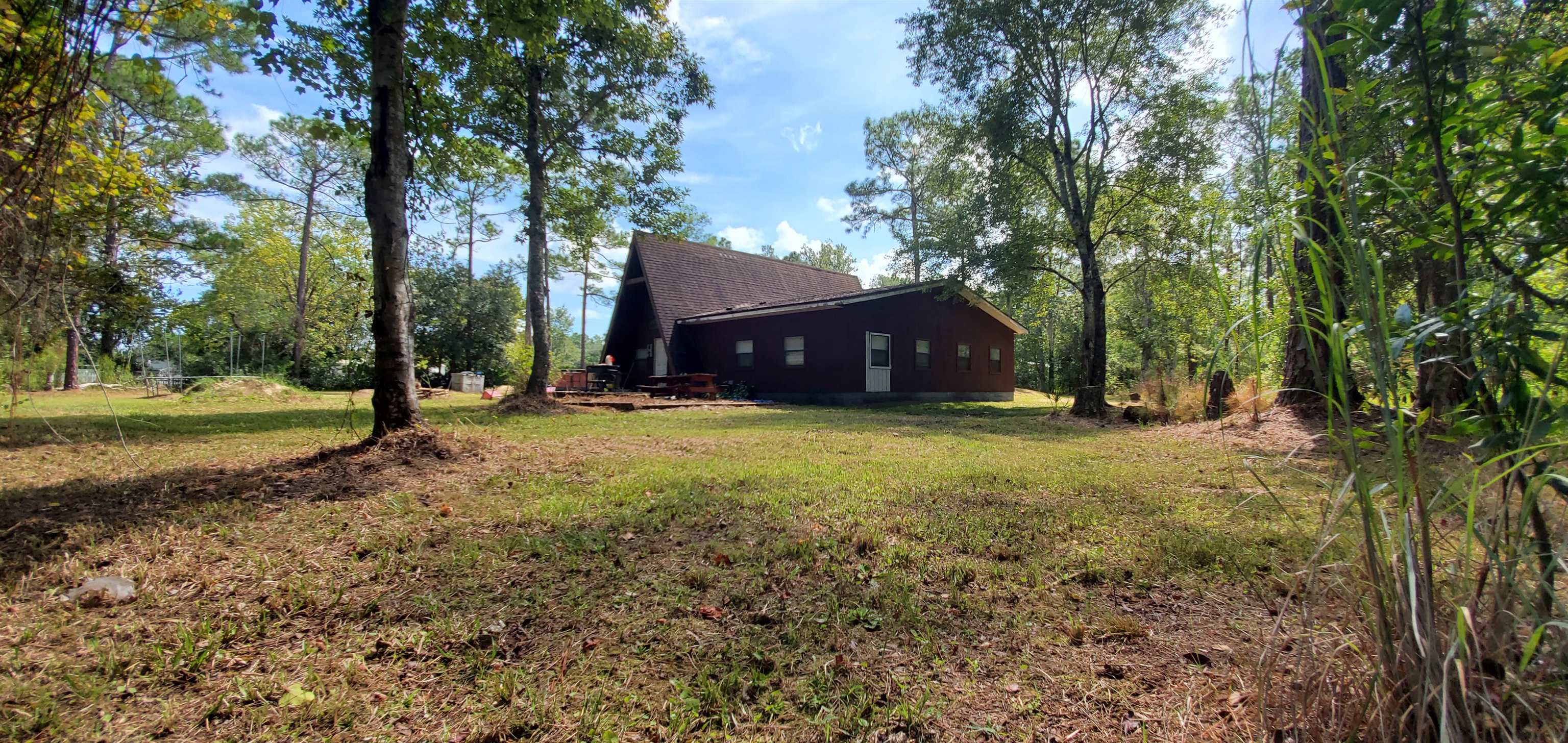 3121 Green Acres Road St. Augustine, FL 32084 - Photo 28 of 35 a view of outdoor space with garden and trees