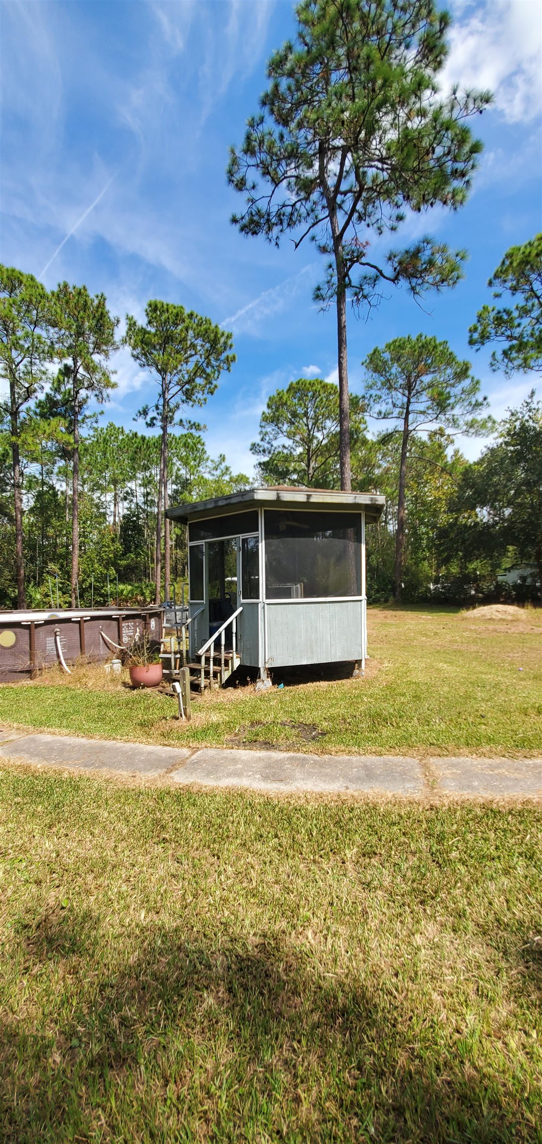 3121 Green Acres Road St. Augustine, FL 32084 - Photo 33 of 35 a view of a swimming pool and a yard