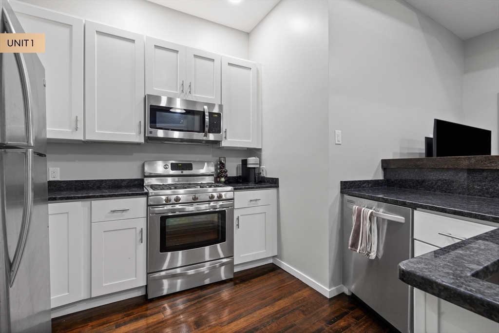 133 Salem Street Boston, MA 02113 - Photo 22 of 27 a kitchen with stainless steel appliances granite countertop a stove a sink and a microwave