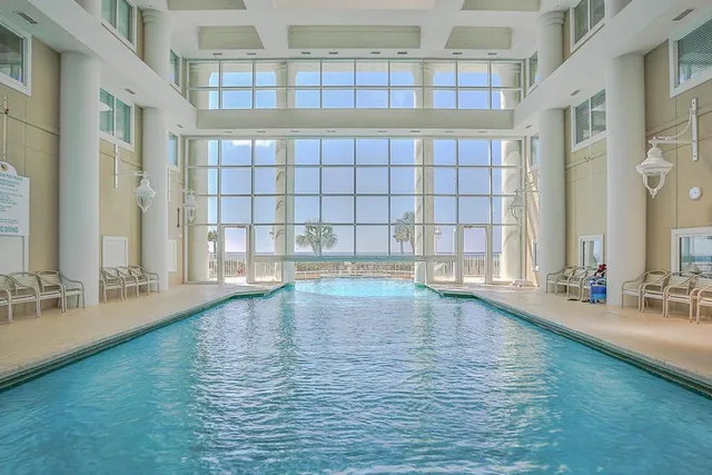 a view of a living room and chandelier