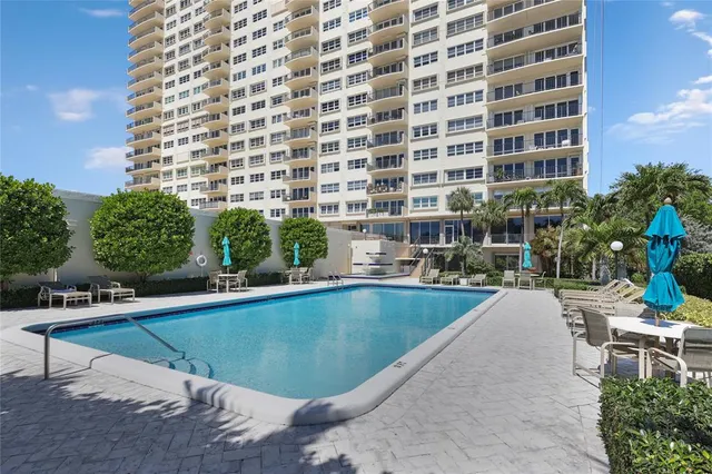a view of a swimming pool from a lounge chair