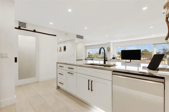 a kitchen with cabinets and sink