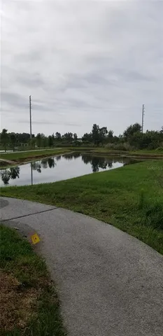 a view of a lake with houses in the back