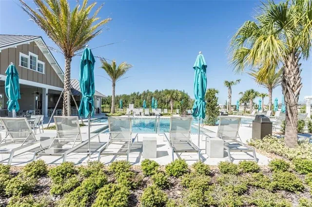 a view of a chair and tables in the patio in front of a building