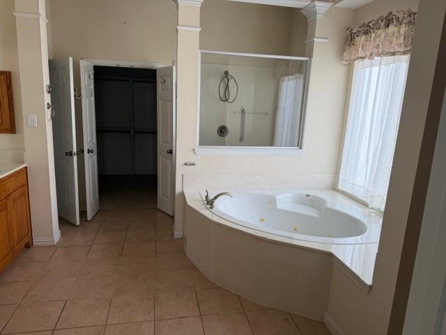 2348 St Paul Road St. Paul, TX 75098 - Photo 16 of 34 a bathroom with a tub sink and mirror